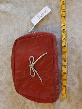 Linea Donna red versatile bag with faux diamond bow accent